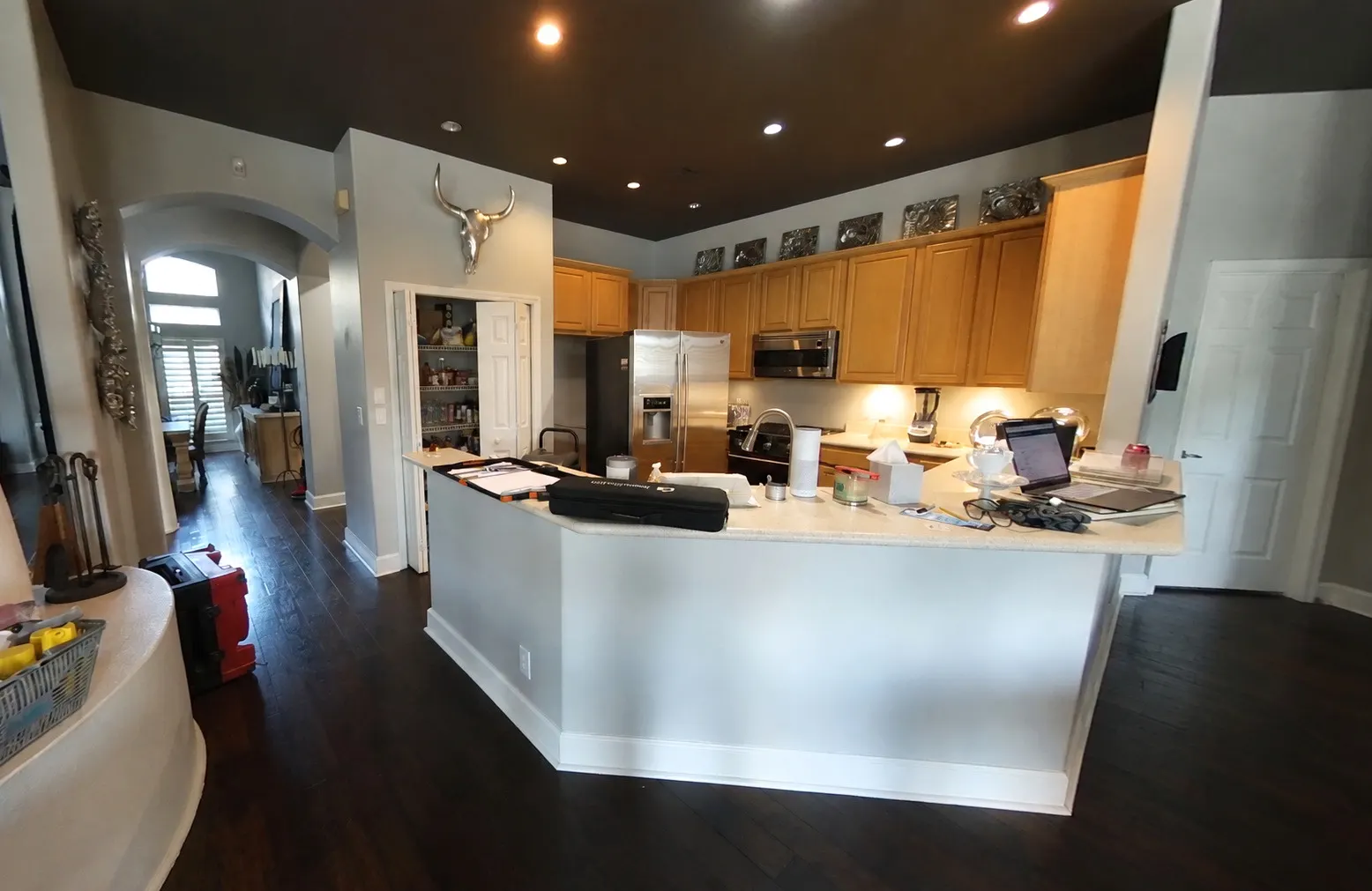 Original Blackwater kitchen with wood cabinets, a raised peninsula and a closet-style pantry.