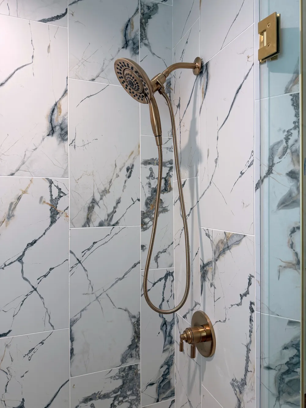 Shower hardware and tile detail in the Calle bathroom.