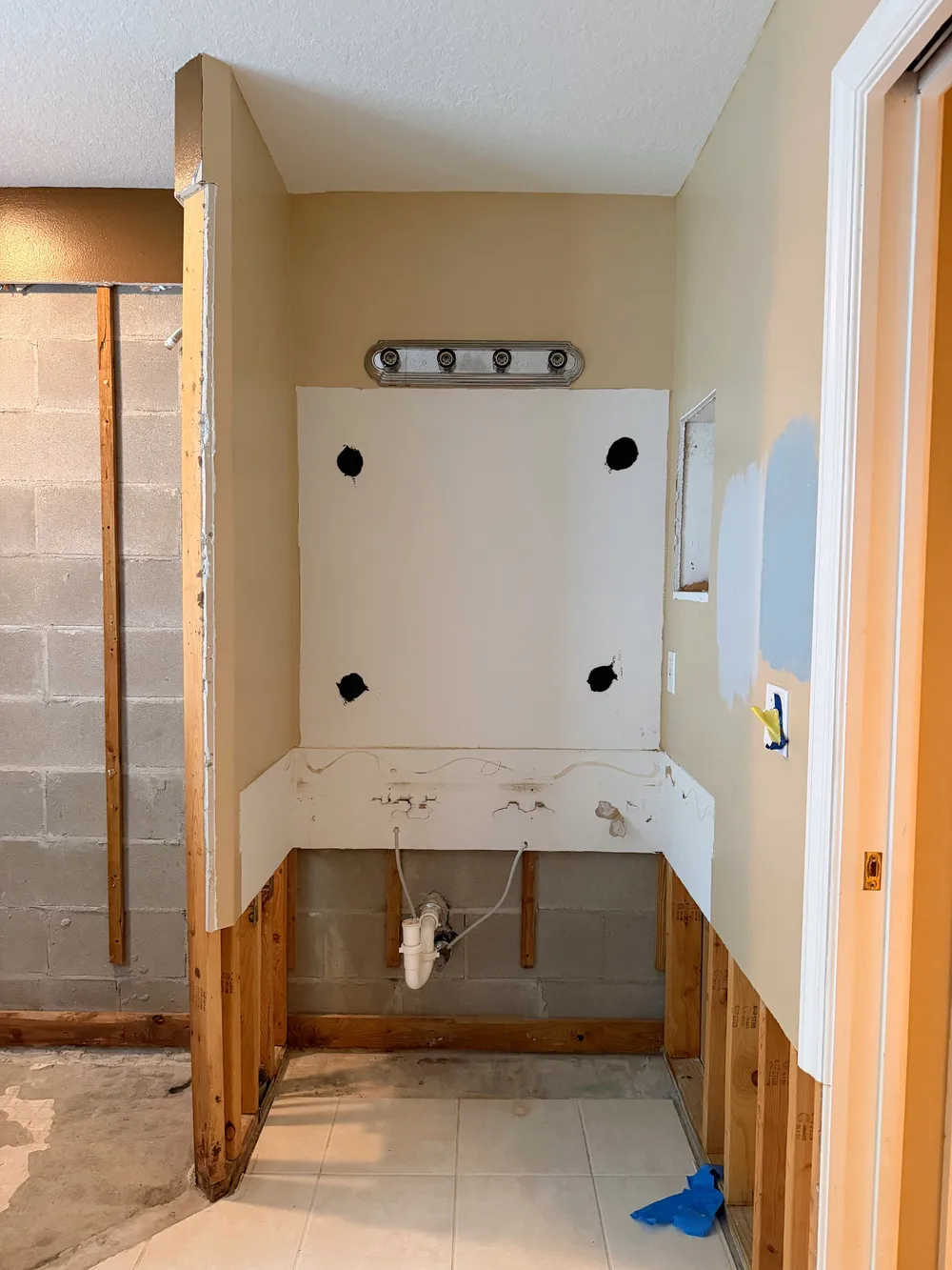 Removed vanity with exposed rough-in in the Calle bathroom.