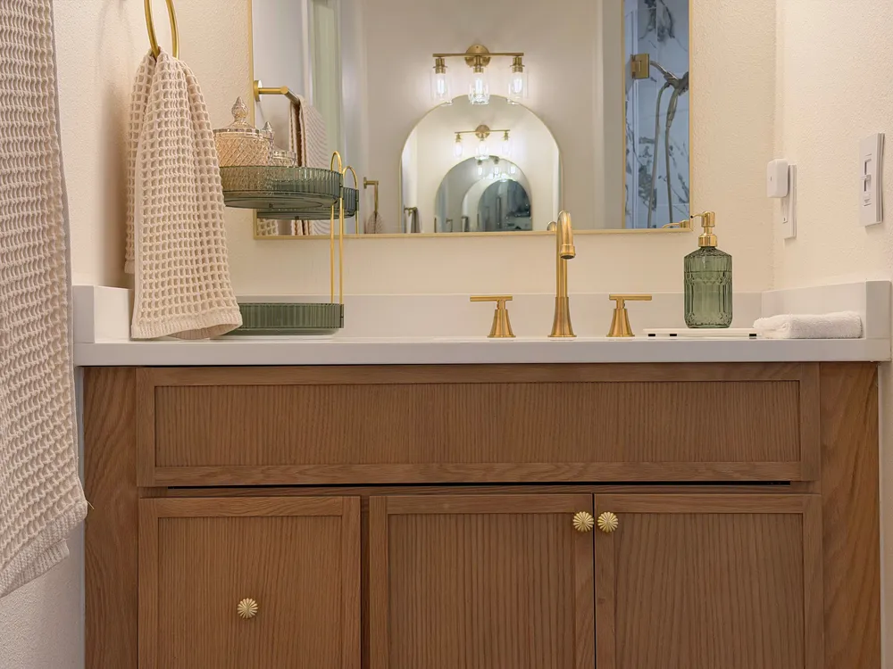 Counter, faucet and cabinet grain in the Calle bathroom.