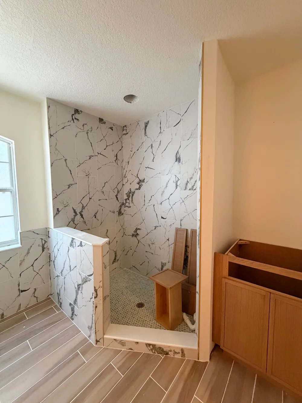 Tile and vanity installation in the Calle bathroom.