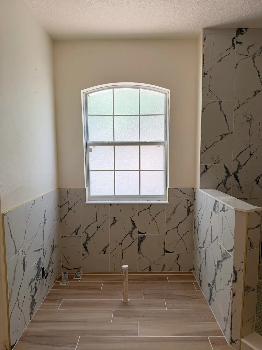 Tiled window bay before fixtures in the Calle bathroom.