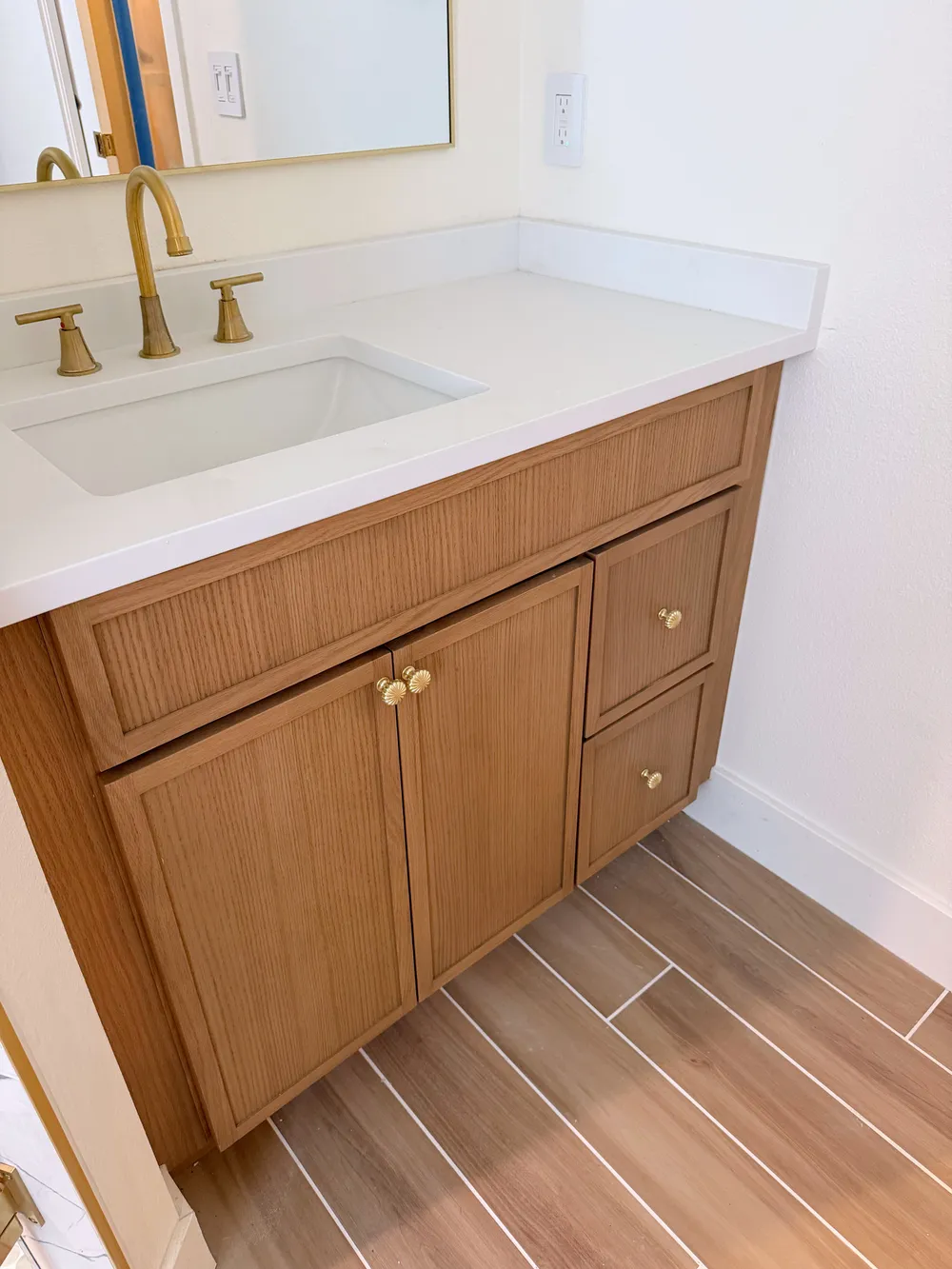 Vanity cabinetry and countertop detail in the Calle bathroom.