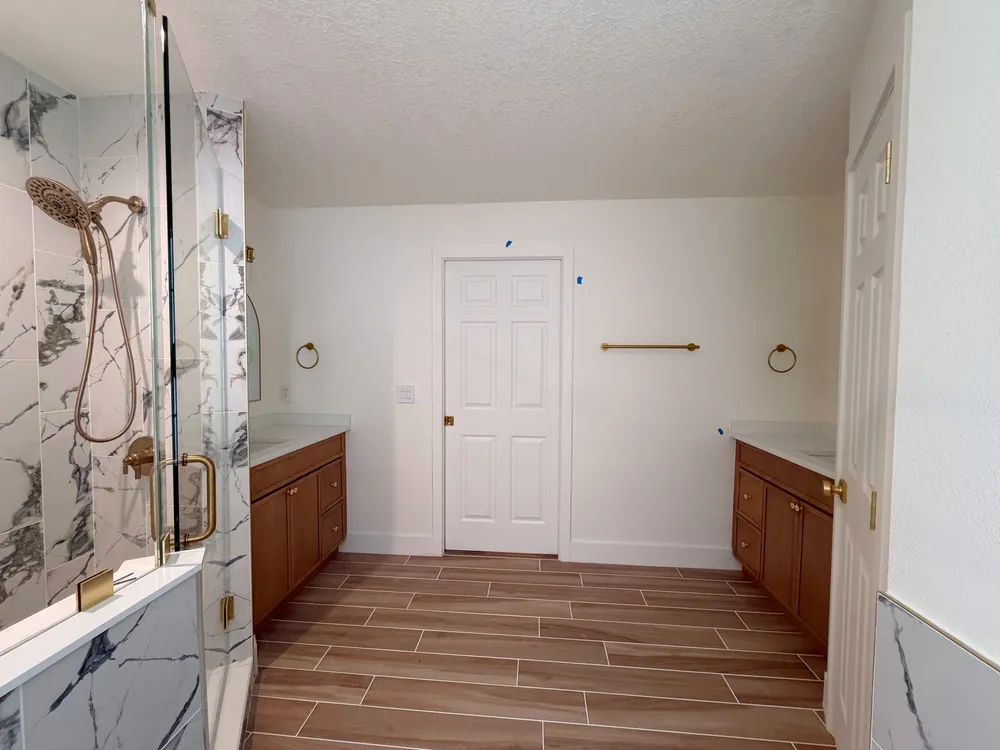 Wide room view during final installation in the Calle bathroom.