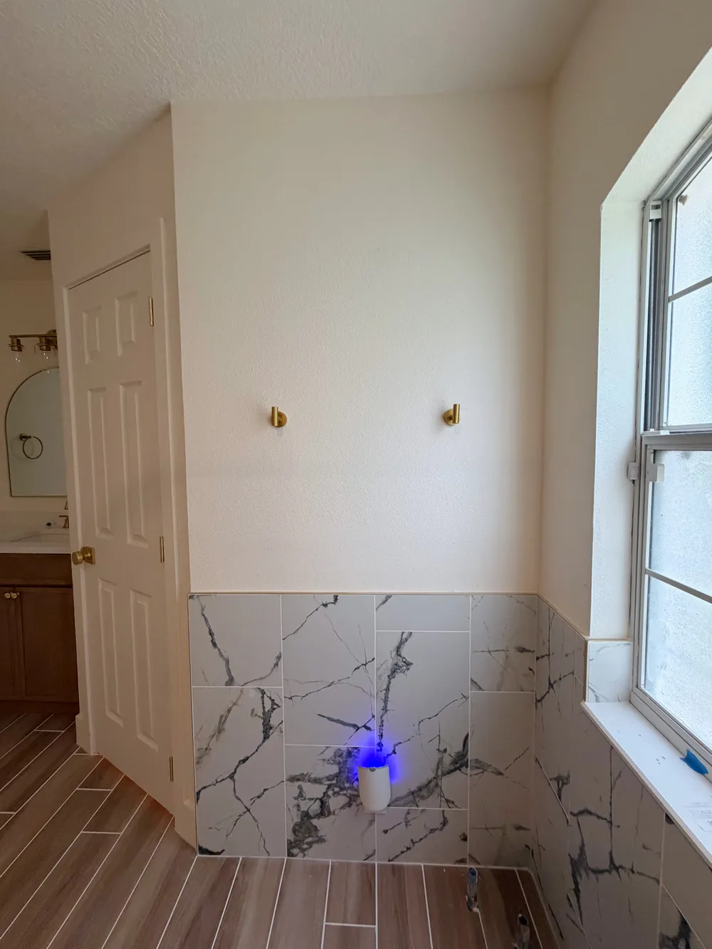 Window wall tile and temporary rough-in in the Calle bathroom.