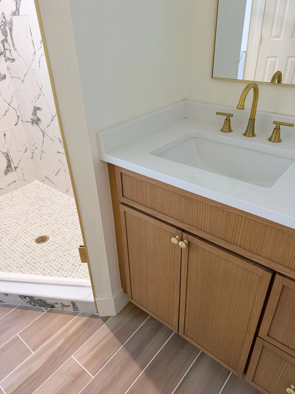 Vanity beside finished shower in the Calle bathroom.
