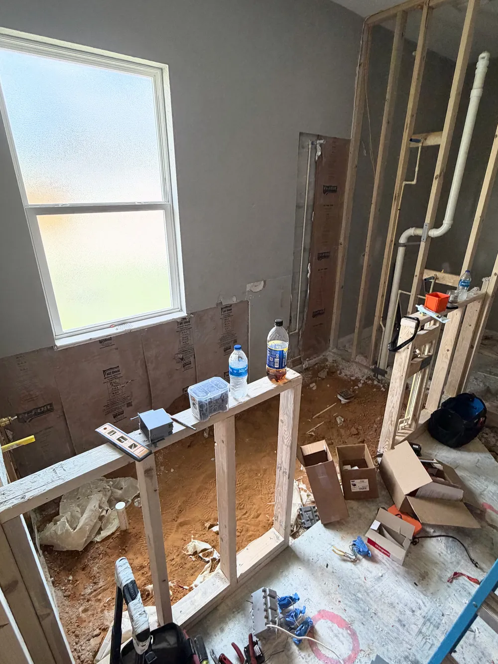 Bathroom rough-in at window and plumbing wall in the Pompano bathroom.