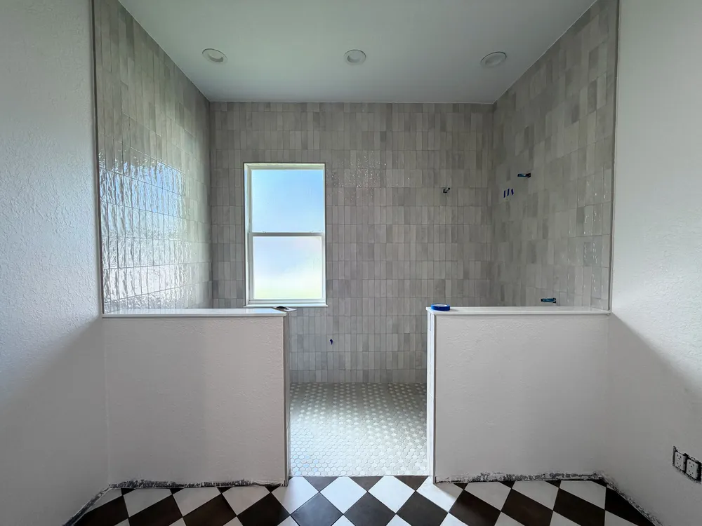 Wet room before fixtures in the Pompano bathroom.