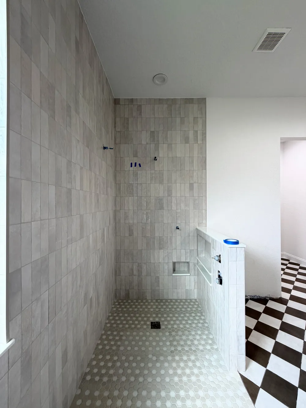 Tiled shower construction overview in the Pompano bathroom.
