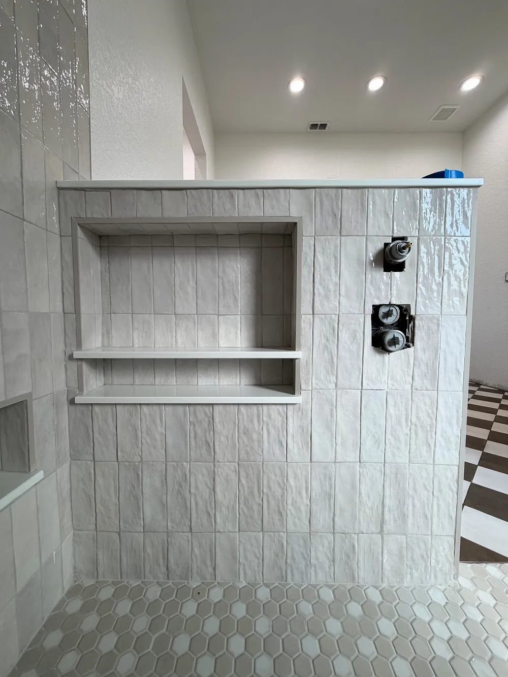 Shower niche and control rough-ins in the Pompano bathroom.