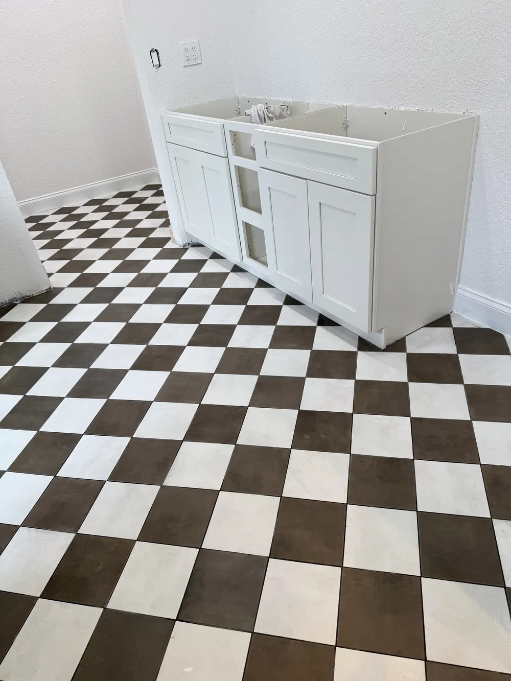 Bathroom vanity cabinet before counter in the Pompano bathroom.