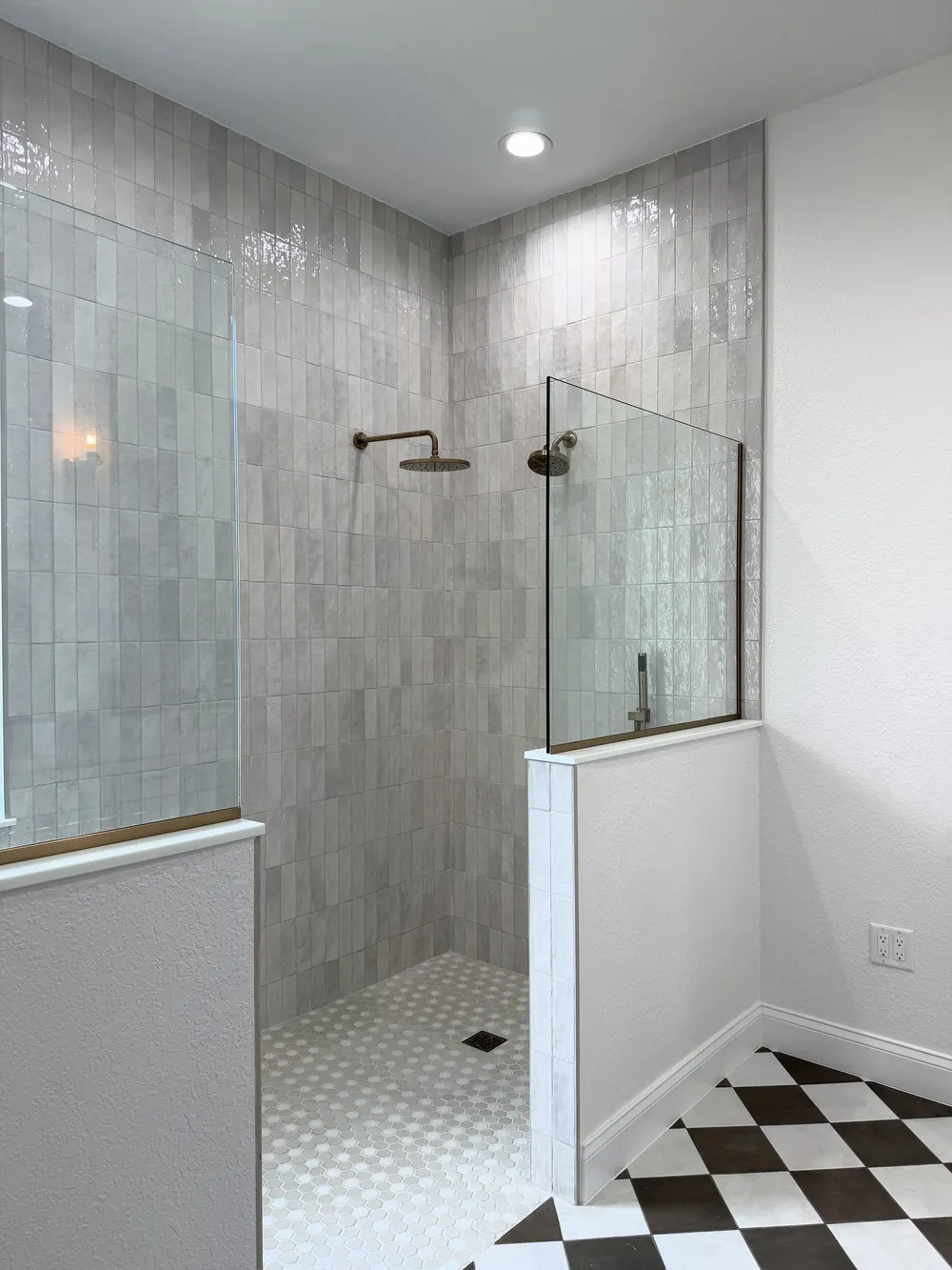 Glass enclosure from the side in the Pompano bathroom.