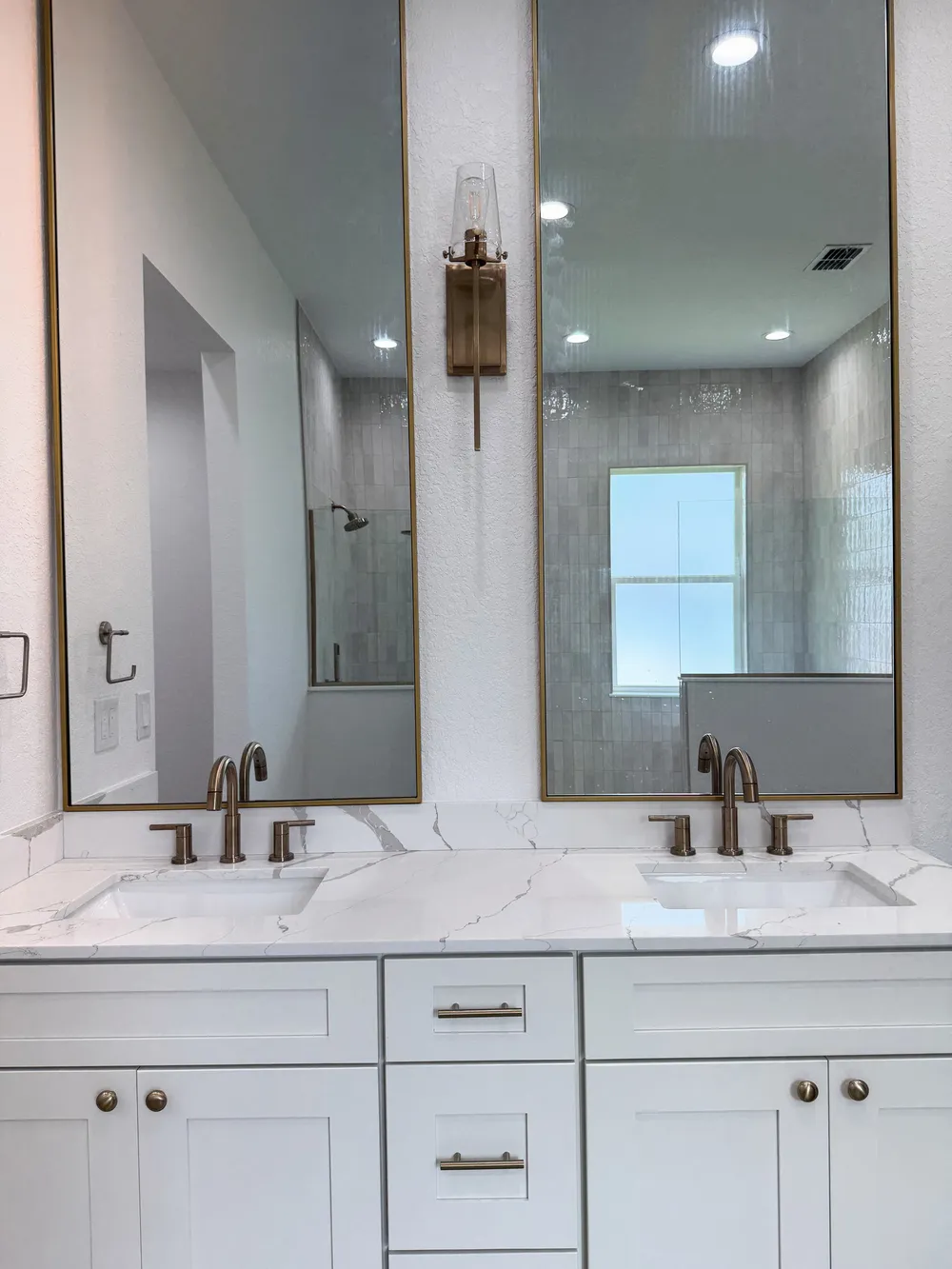 Finished double vanity and mirrors in the Pompano bathroom.