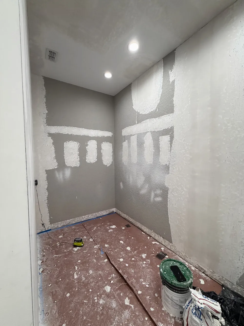 Drywall patching before finish in the Pompano bathroom.