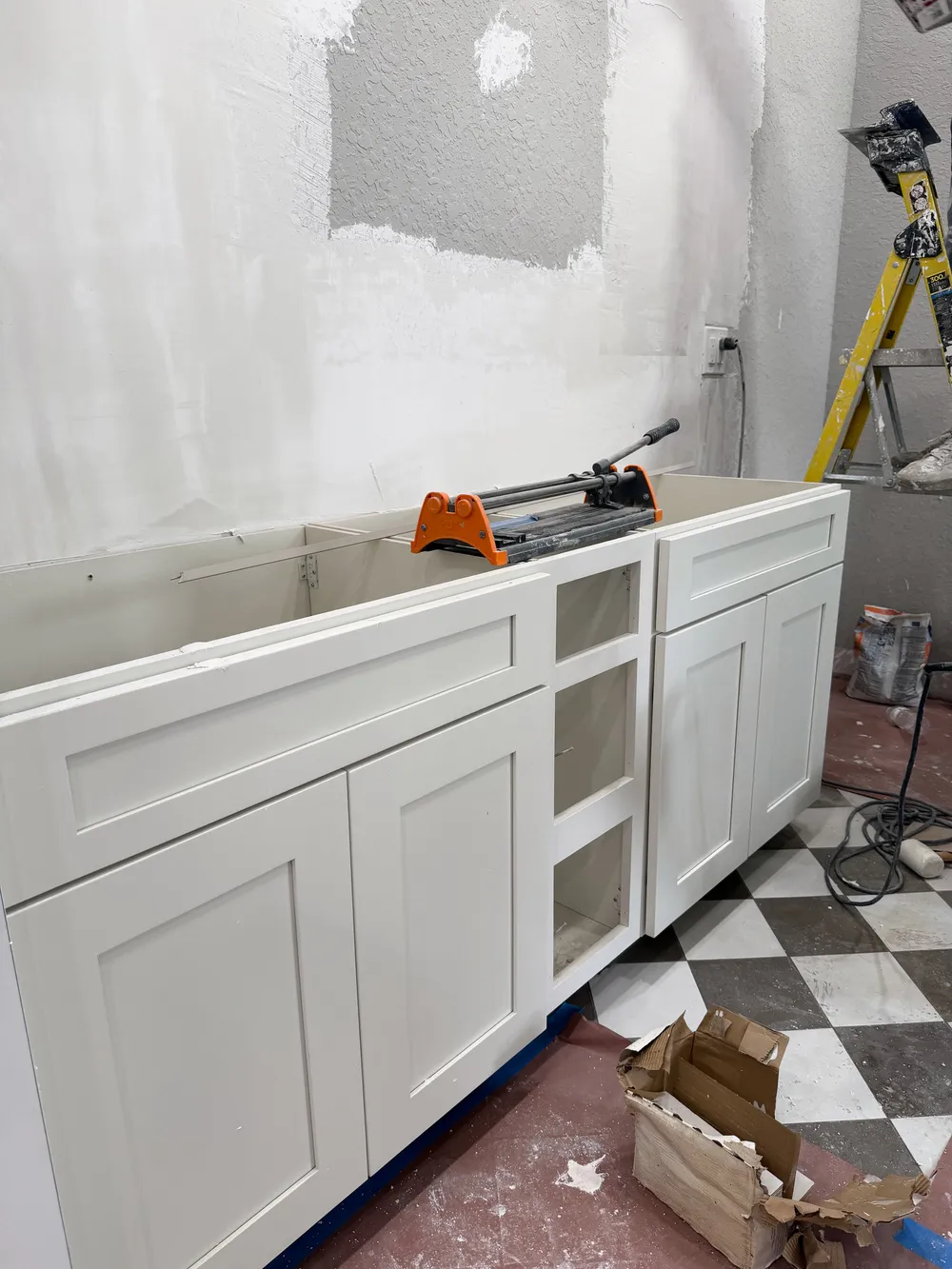 Vanity cabinet installation in the Pompano bathroom.