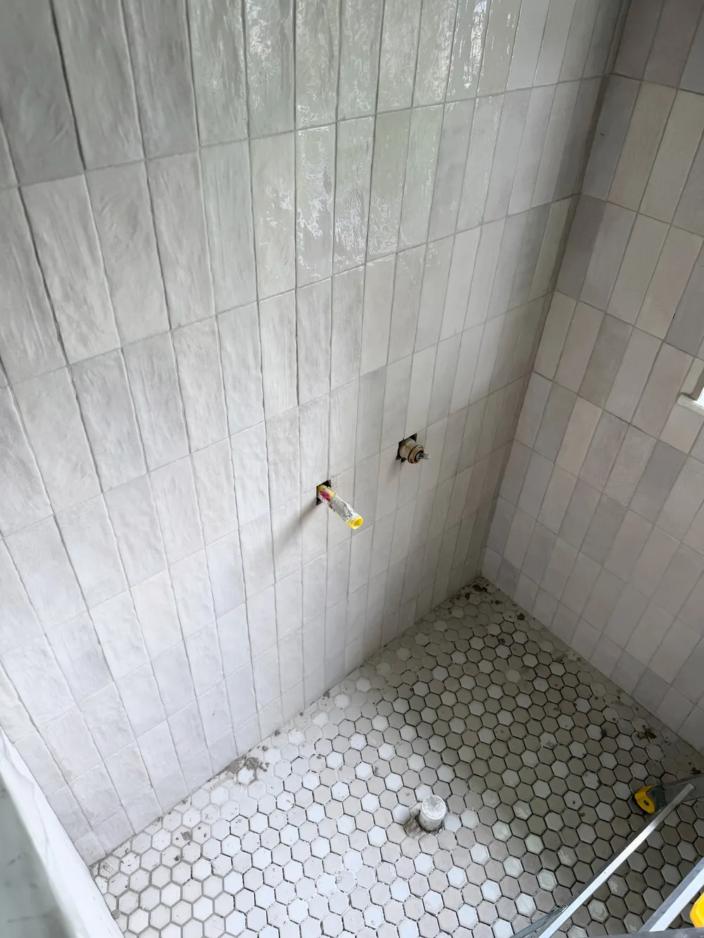 Shower plumbing before trim in the Pompano bathroom.