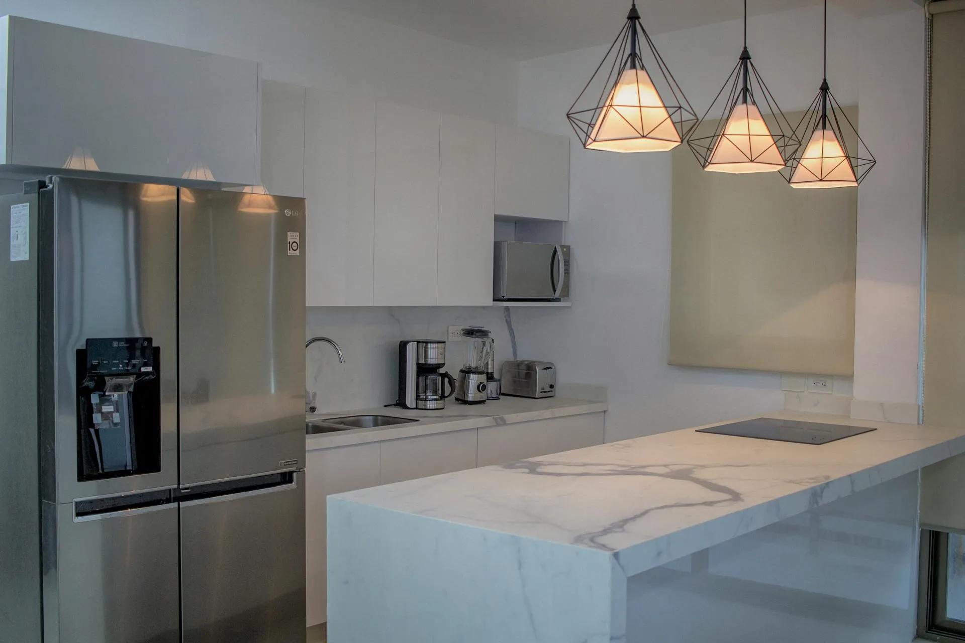 Carrara Quartz with Gray Veins and White Kitchen Cabinets