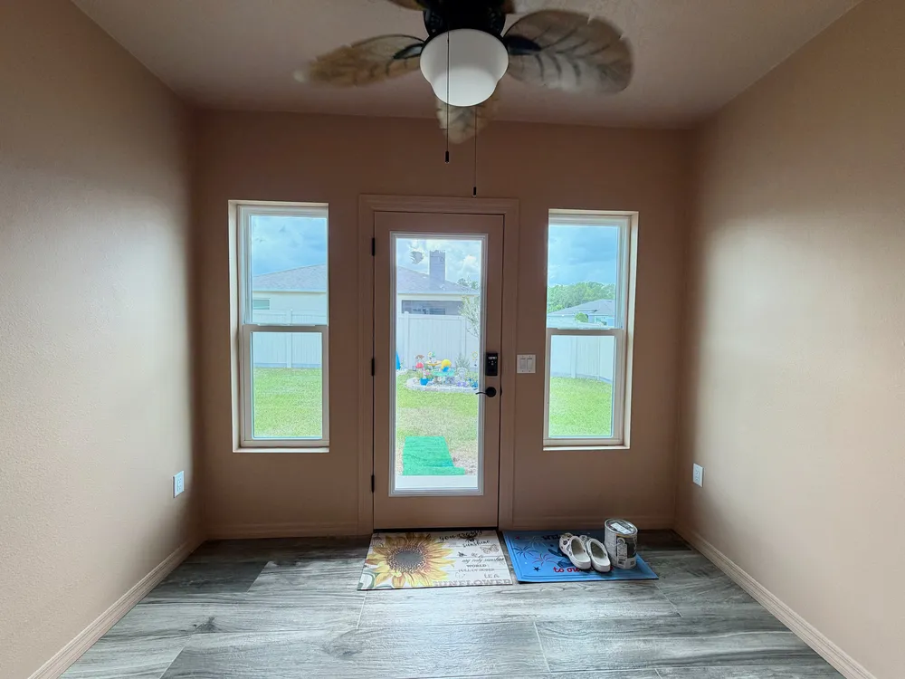 Room looking toward the exterior door in the Edgemont patio enclosure.