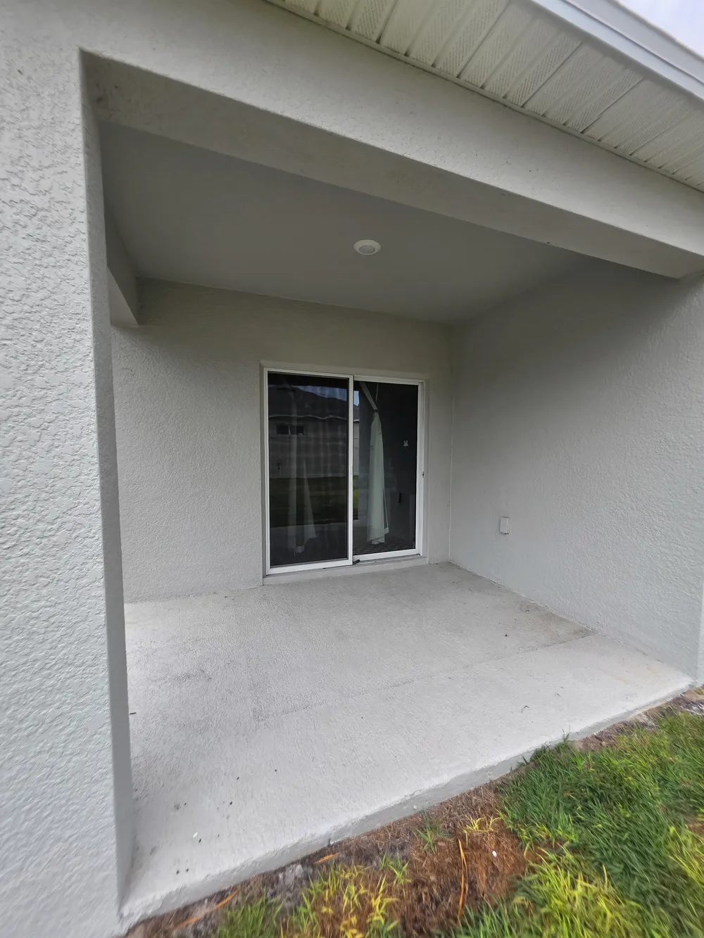 Existing covered patio, exterior angle in the Edgemont patio enclosure.