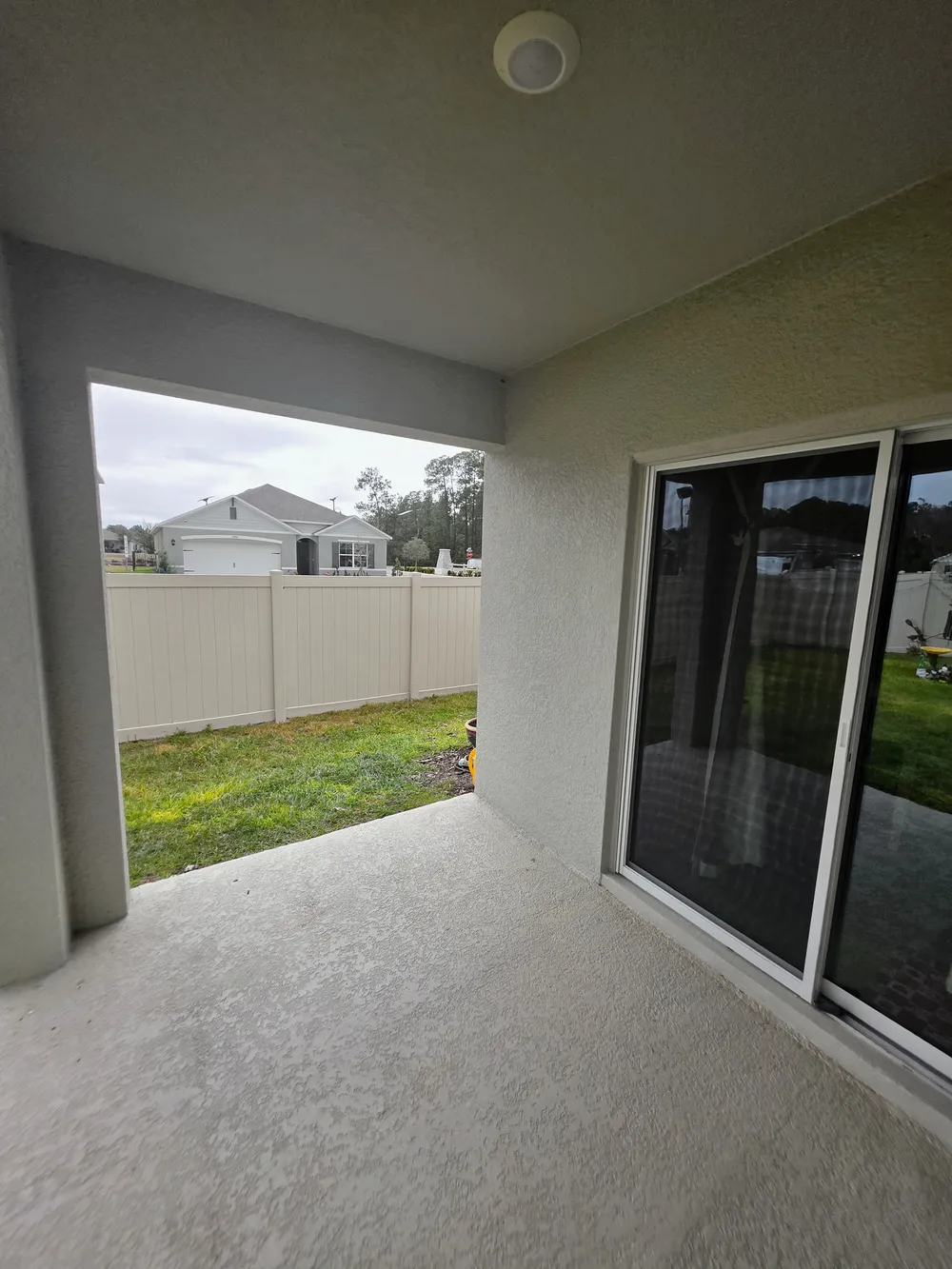 Existing patio looking toward the yard in the Edgemont patio enclosure.