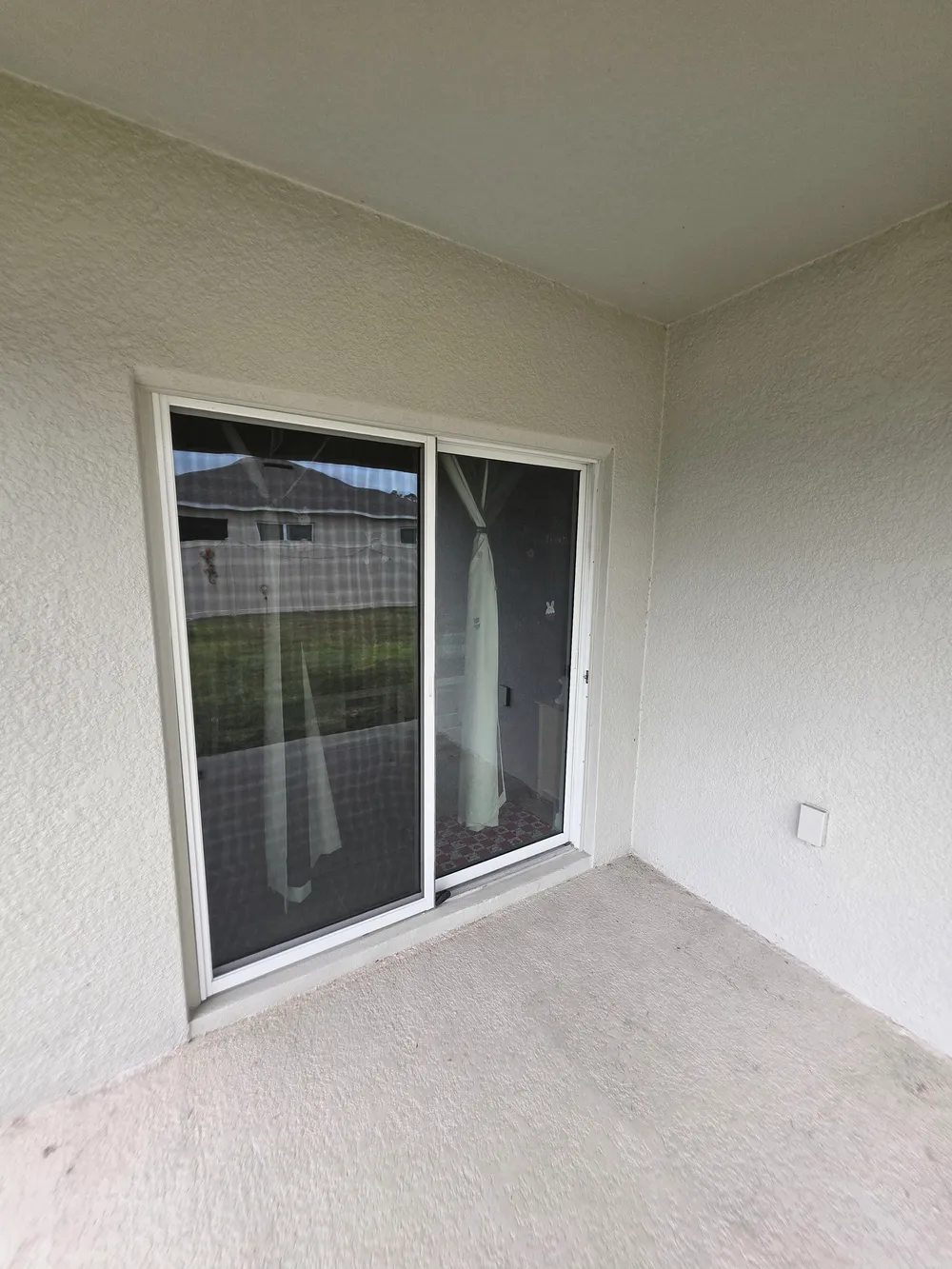 Original sliding door into the home in the Edgemont patio enclosure.