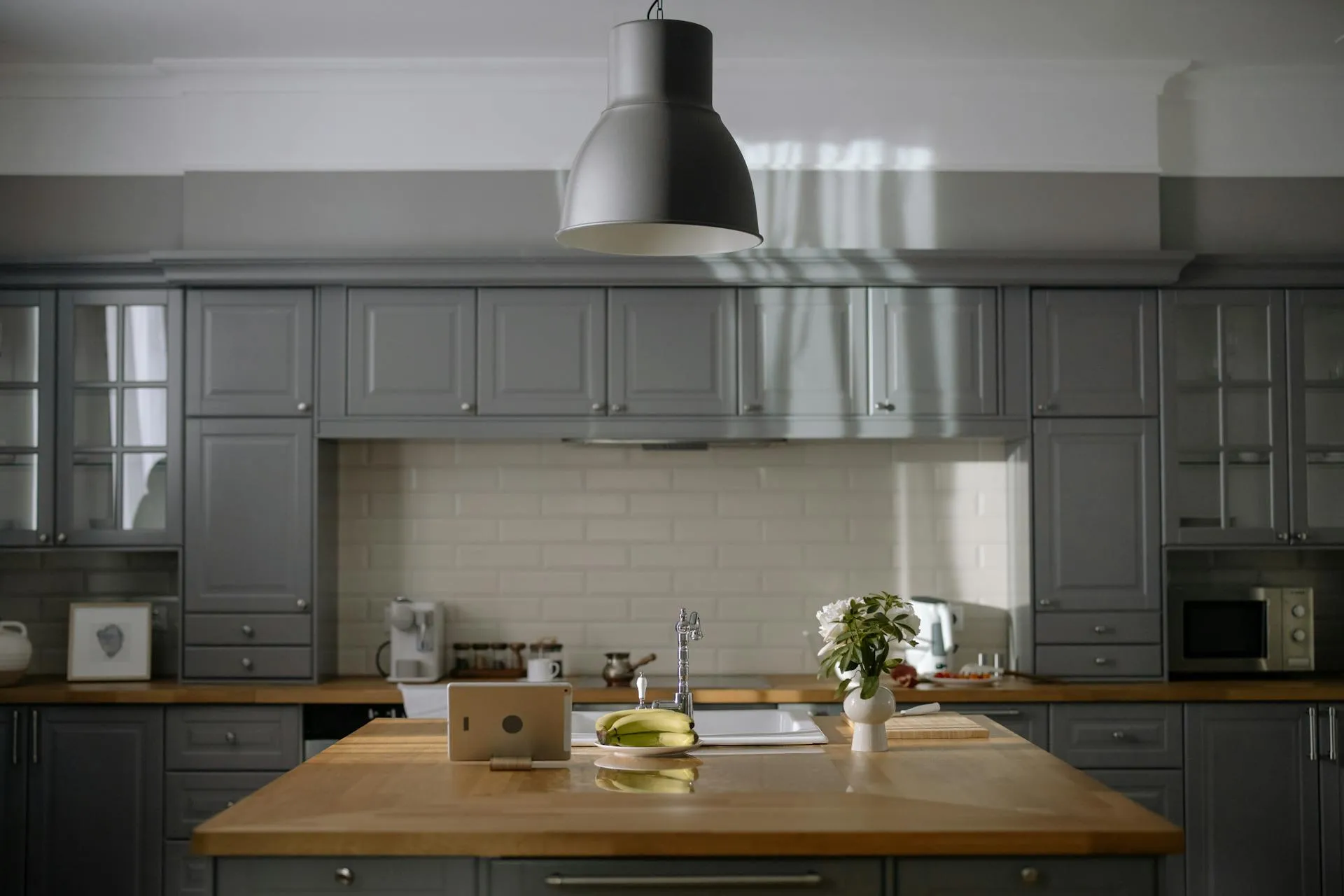 Gray Cabinets with Crown Molding and Butcher Block Countertop