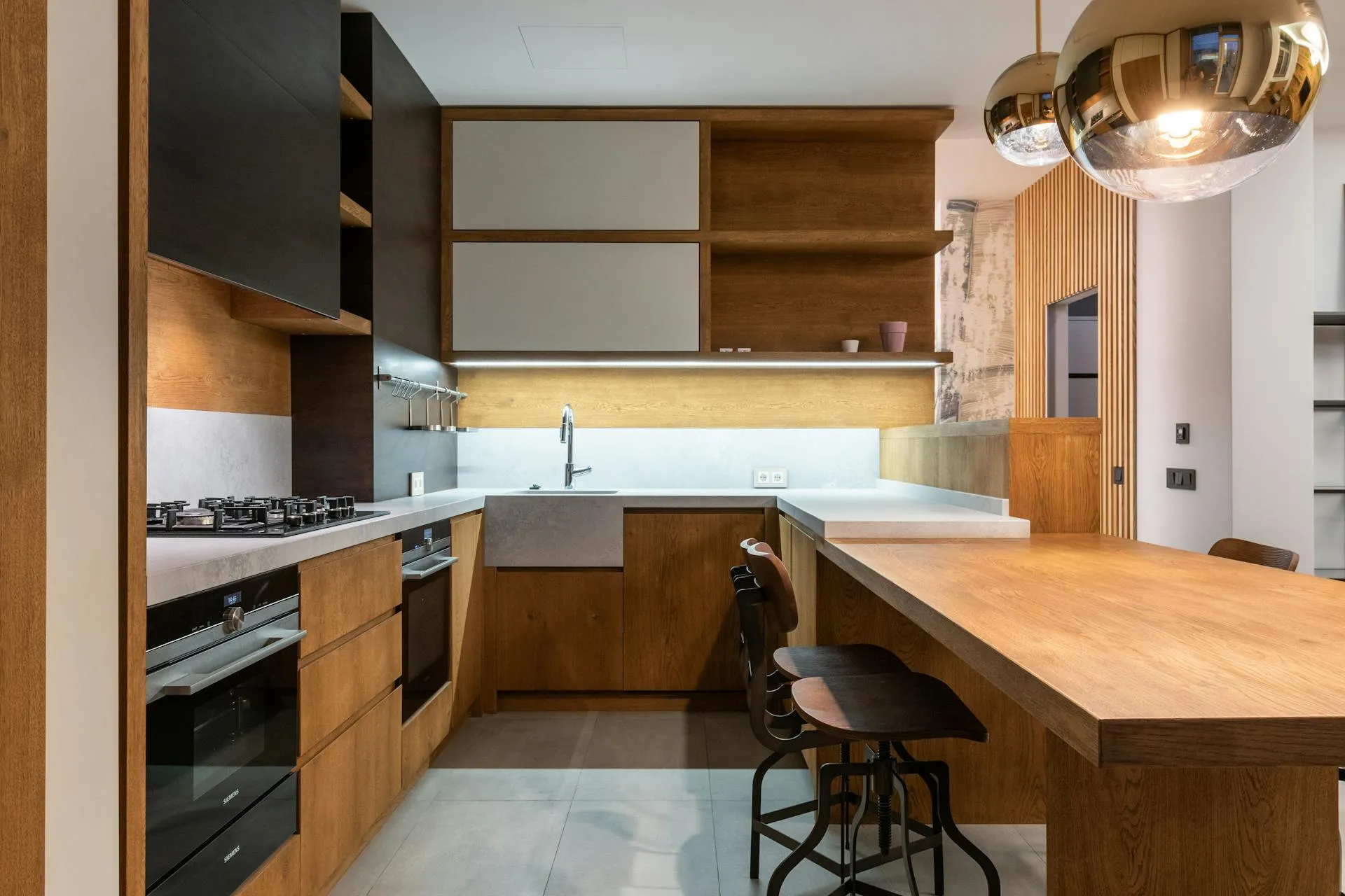 Modern Open Cabinets with Black and White Doors and Wood Countertops