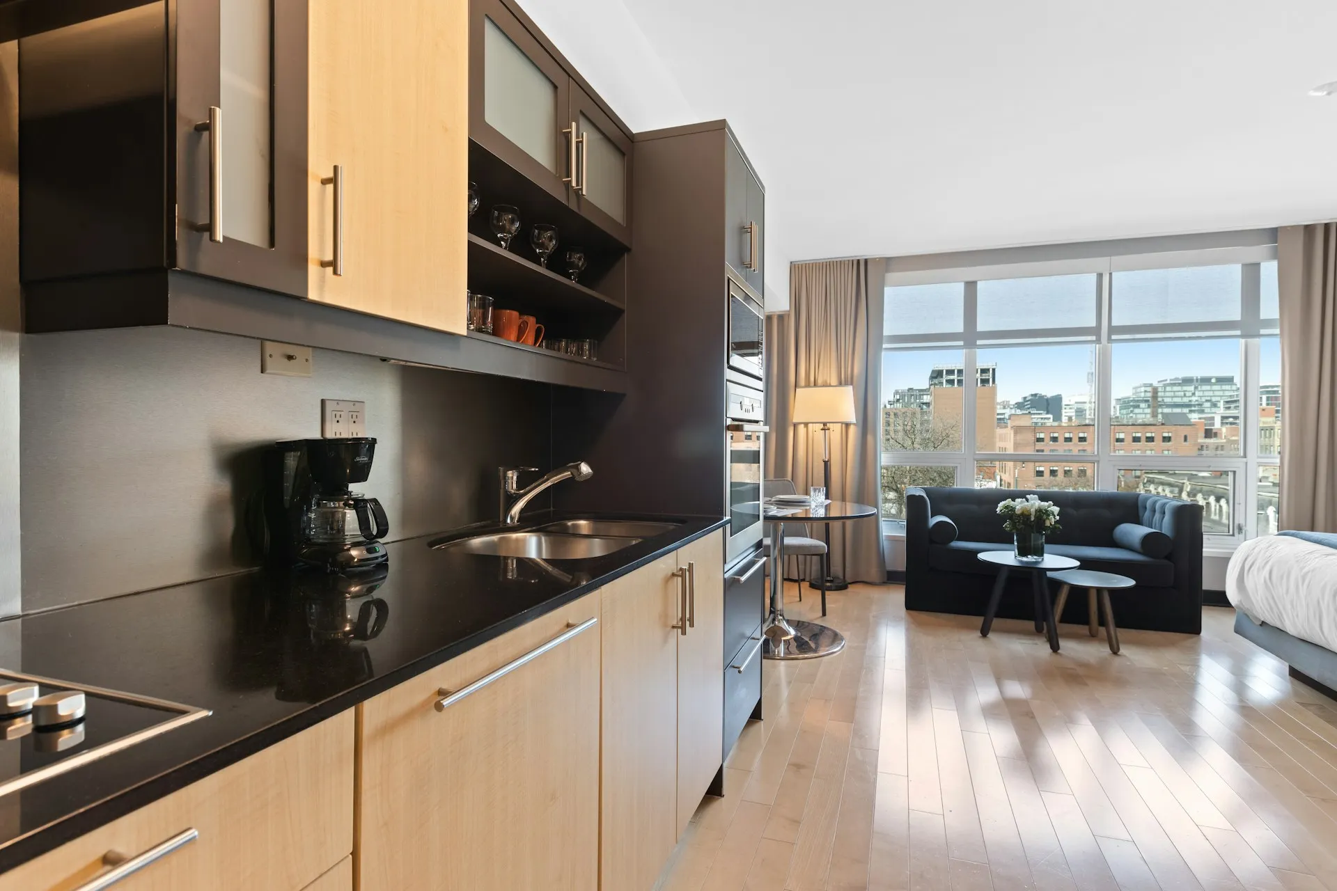 Two tone kitchen with black countertops