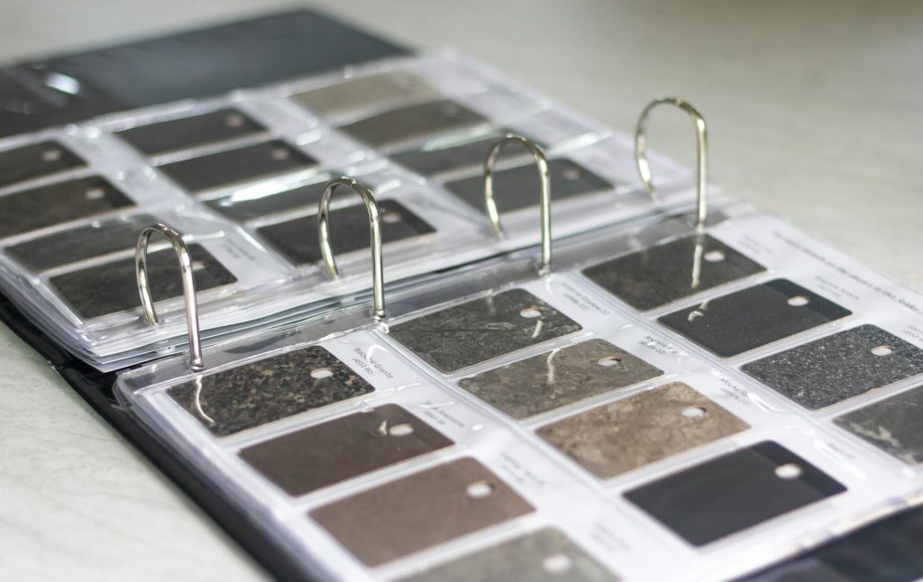 two tone kitchen with black countertops
